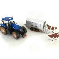 Muddy New Holland Tractor with Ifor Williams Trailer